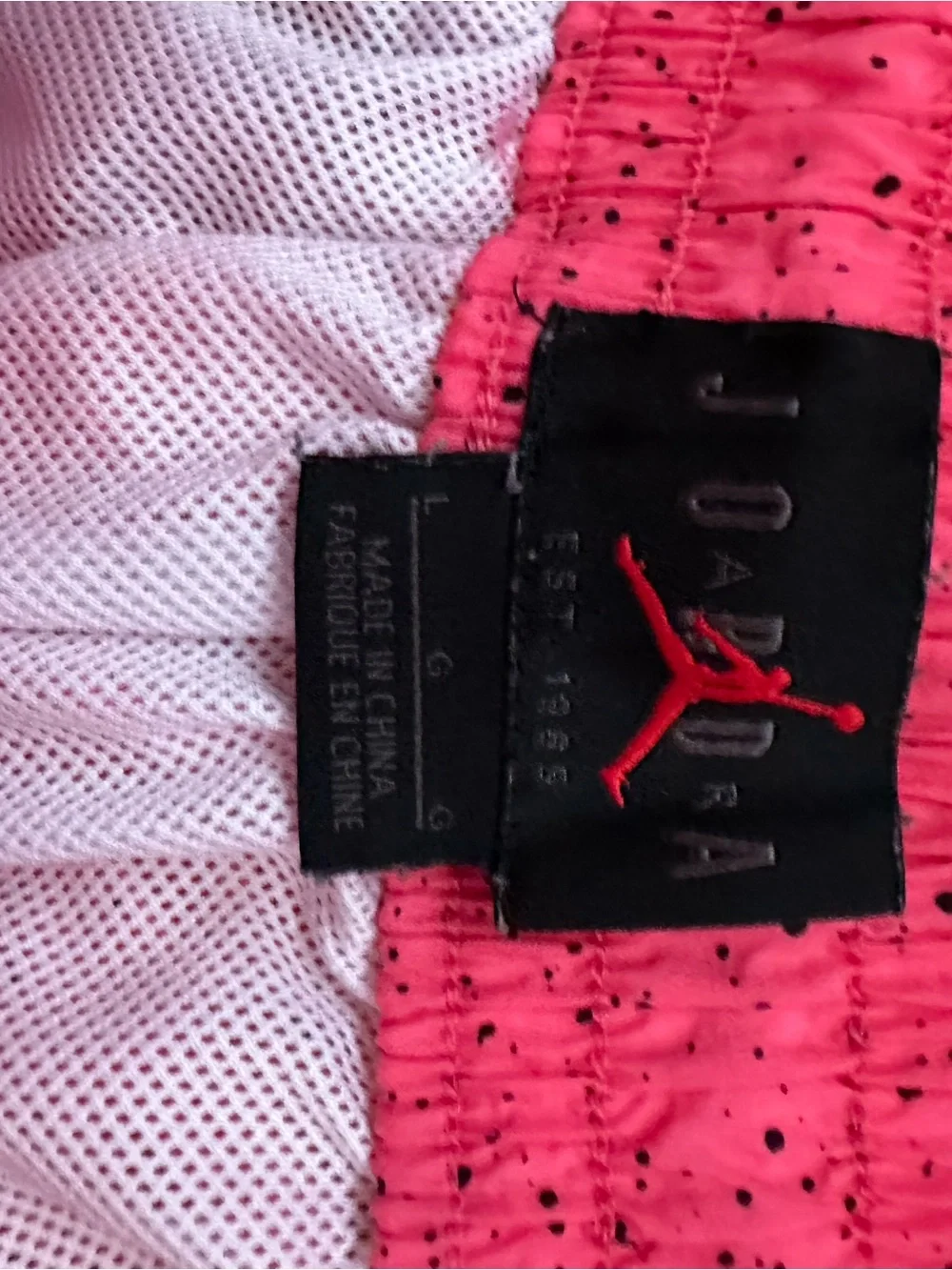 Jordan Men’s Pink Swim Trunks with Yellow Jumpman